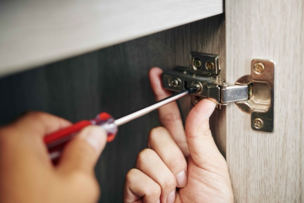 Door hinge adjustment and repair — West London