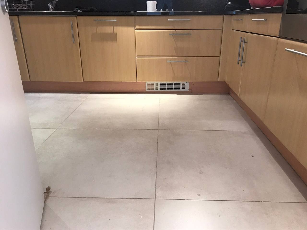Large format floor tiling in kitchen — West London
